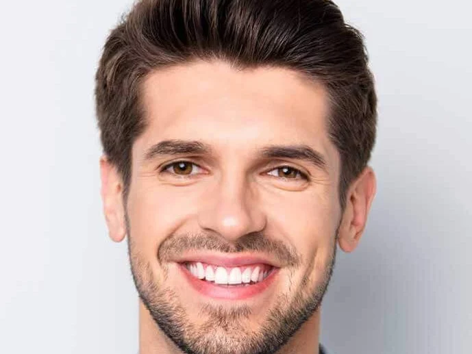 Patient smiling during clear aligner treatment