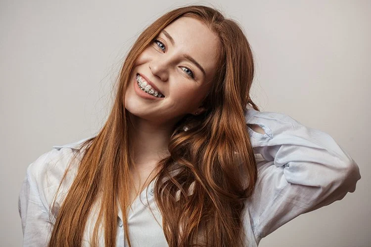 Adult patient with clear ceramic braces